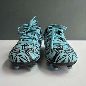PUMAs kids soccer cleats in size 11 featuring a bold blue and black graphic